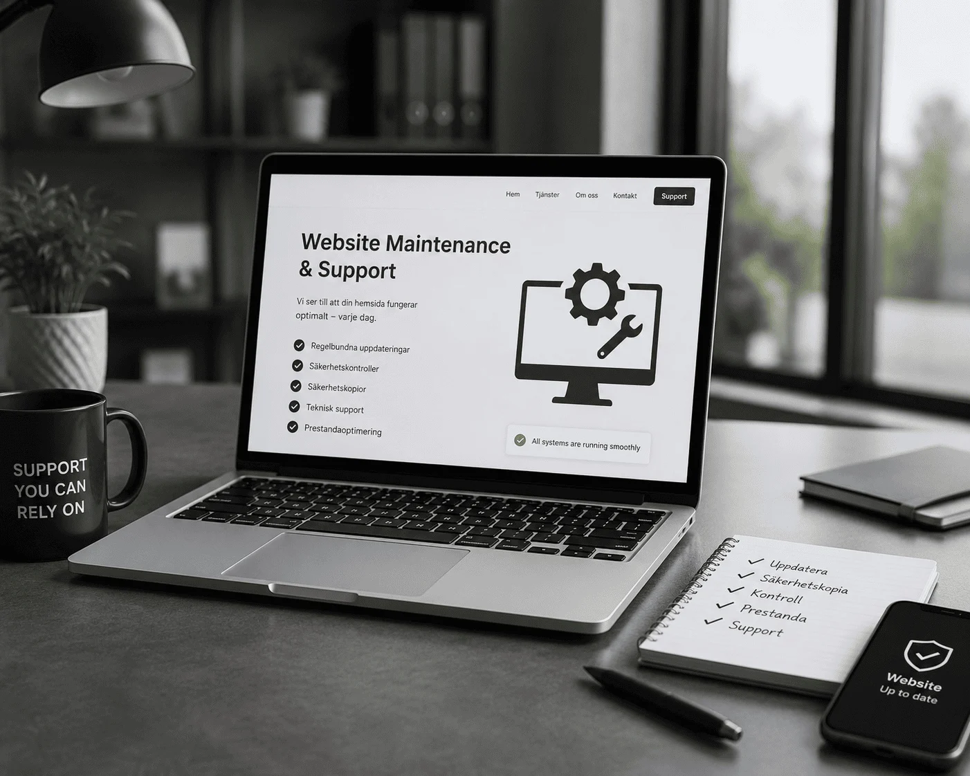 Laptop displaying website maintenance and support page